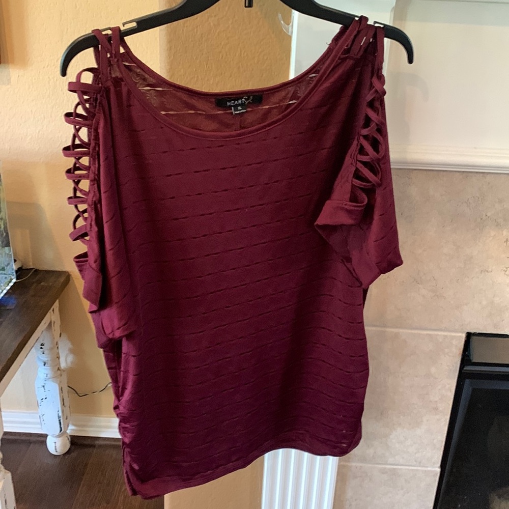 Woman’s maroon blouse